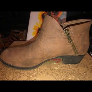 Women’s short tan booties.